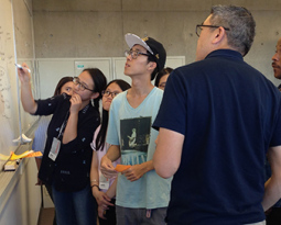Students reporting to Kevin Mihata on their progress during a user research project. Students working at the C21 Story Institute