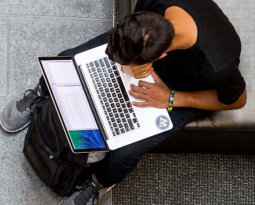 UW student studying w/laptop on outdoor steps UW student studying w/laptop on outdoor steps